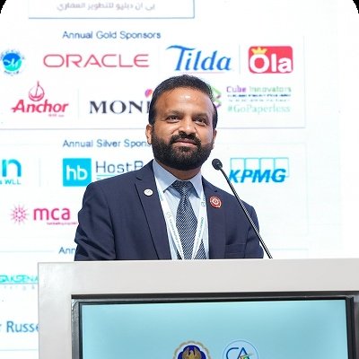 Speaker with sponsor backdrop